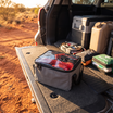 Heavy-Duty Canvas Storage Bag with Clear Lid – in use at a red-dirt outback track at golden hour