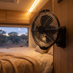 12V/24V 360° Swivel Camp Fan – mounted inside a camper trailer at dusk