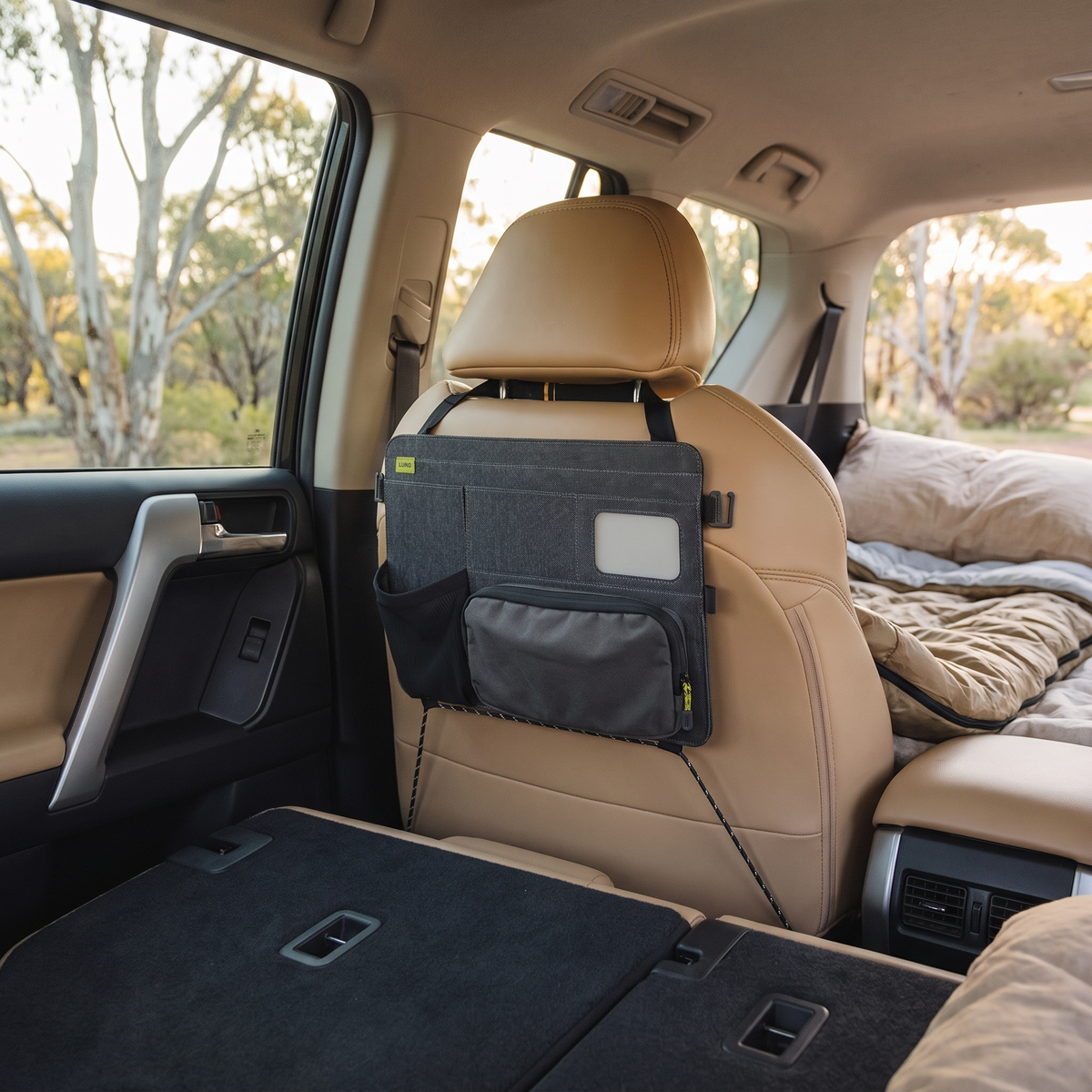 Car Seatback Organiser with Removable Pouch – in use at a eucalyptus bush campsite in soft morning light