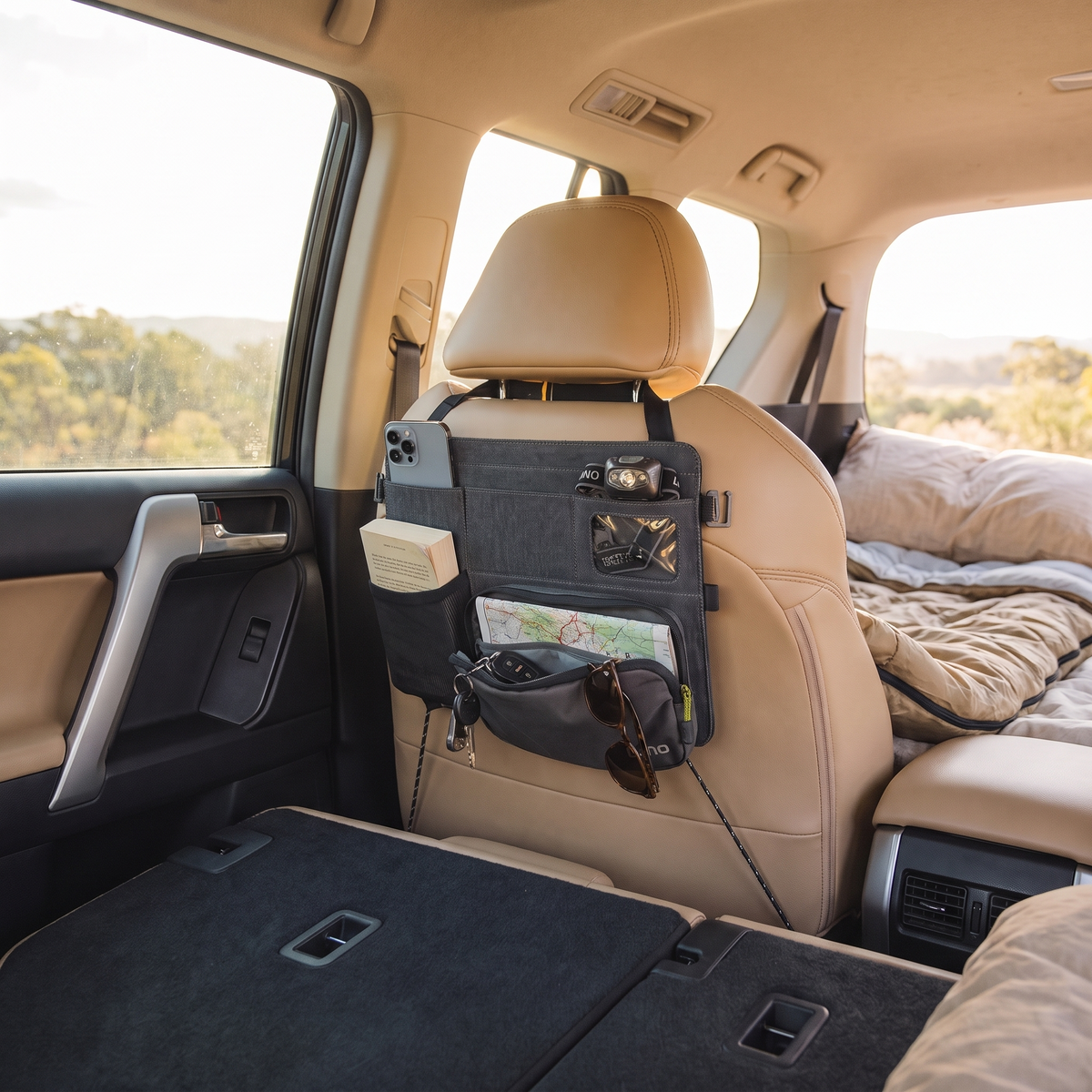 Car Seatback Organiser with Removable Pouch – loaded with essentials in use