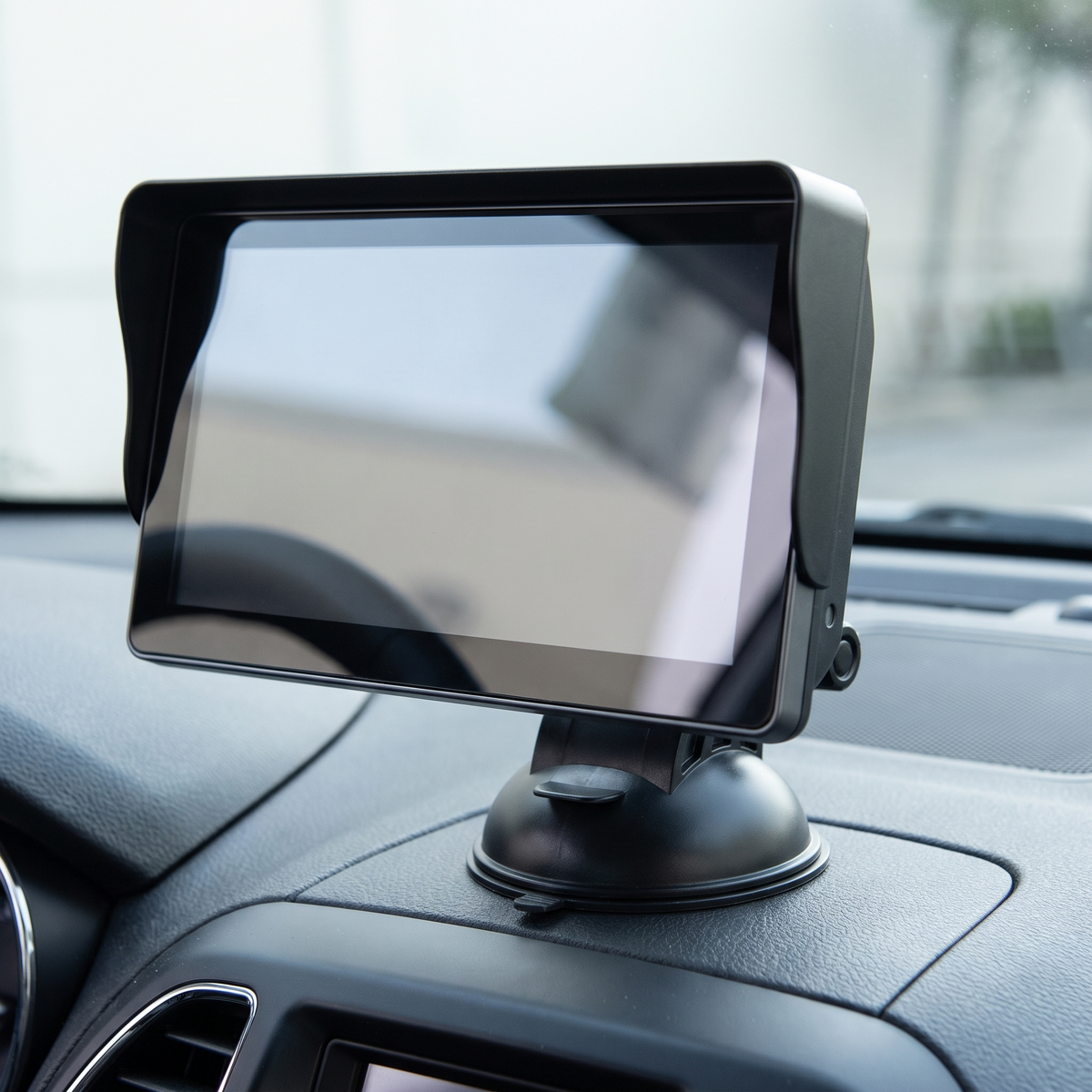 7-Inch Portable Wireless CarPlay & Android Auto Screen – three-quarter view on its suction-cup mount