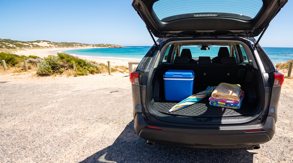Beach gear on a boot mat in an SUV